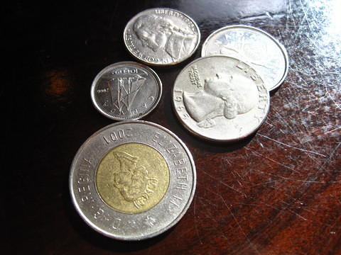 Picture of US coins given as change at a Canadian restaurant